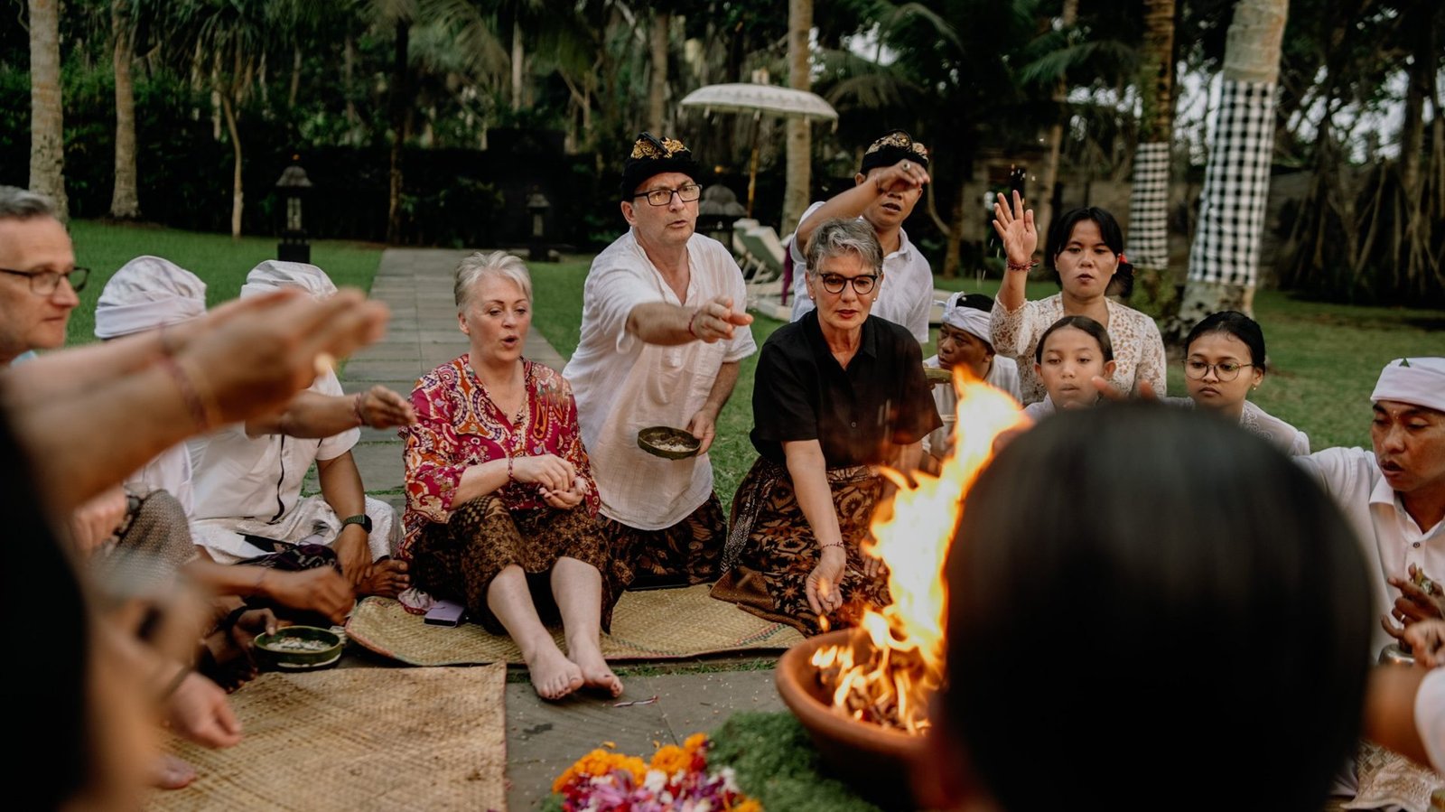 Guests offering rice to the sacred fire